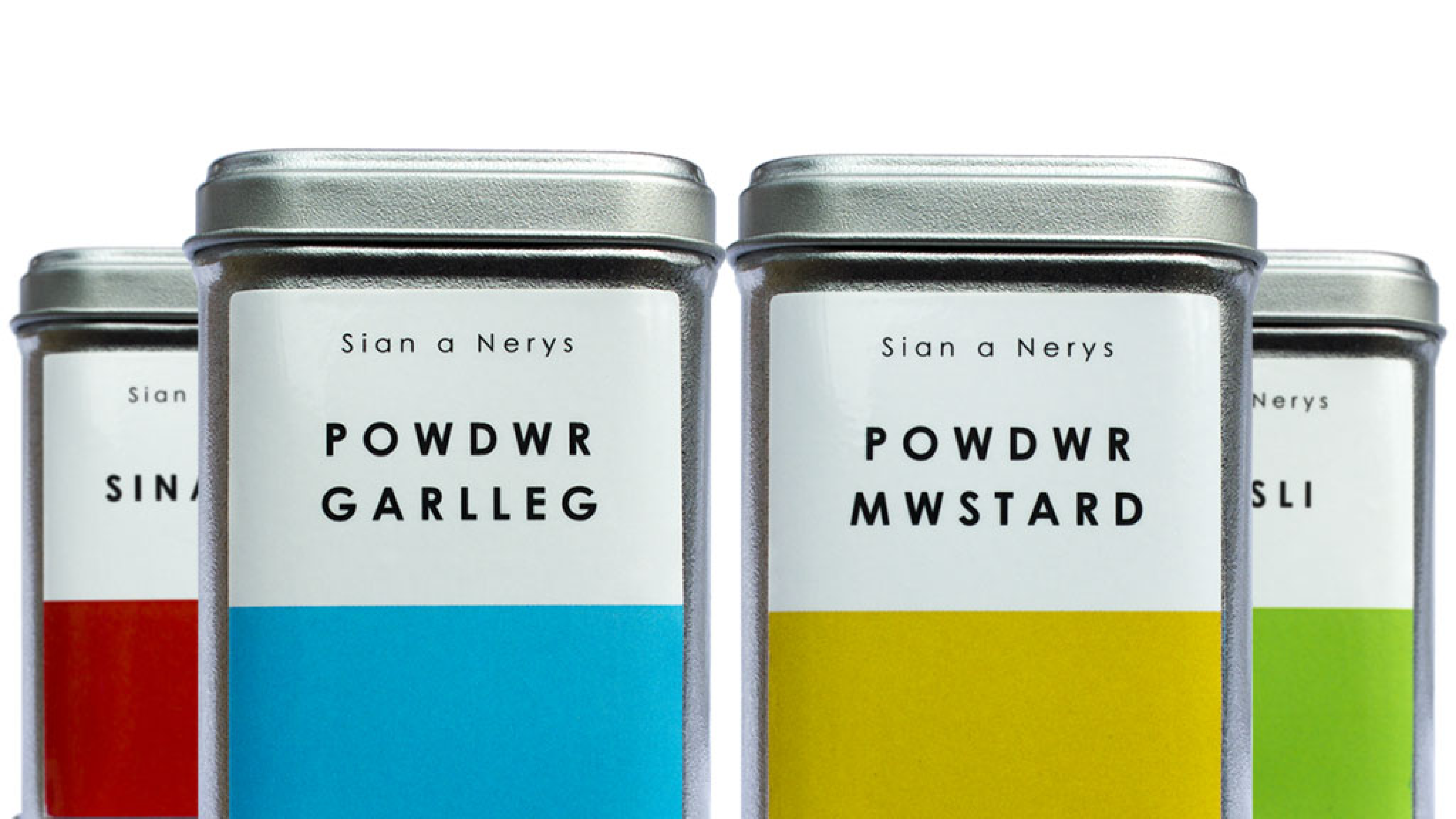 Sian a Nerys Welsh language spice tin packaging with labels.