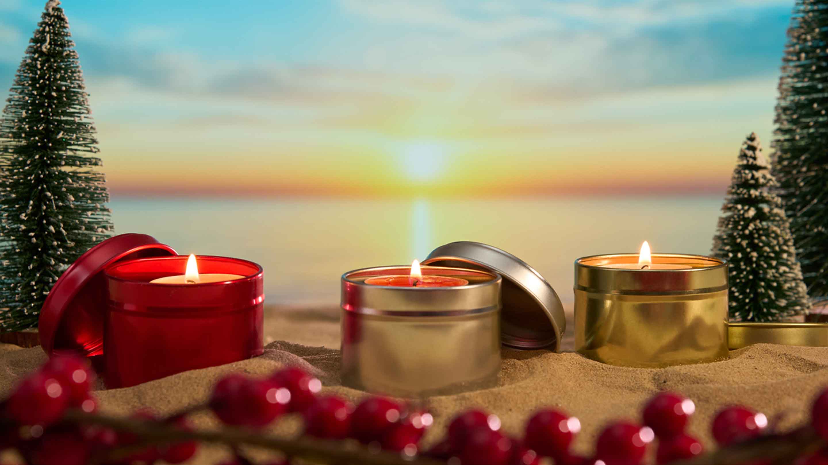 Festive candle packaging on beach