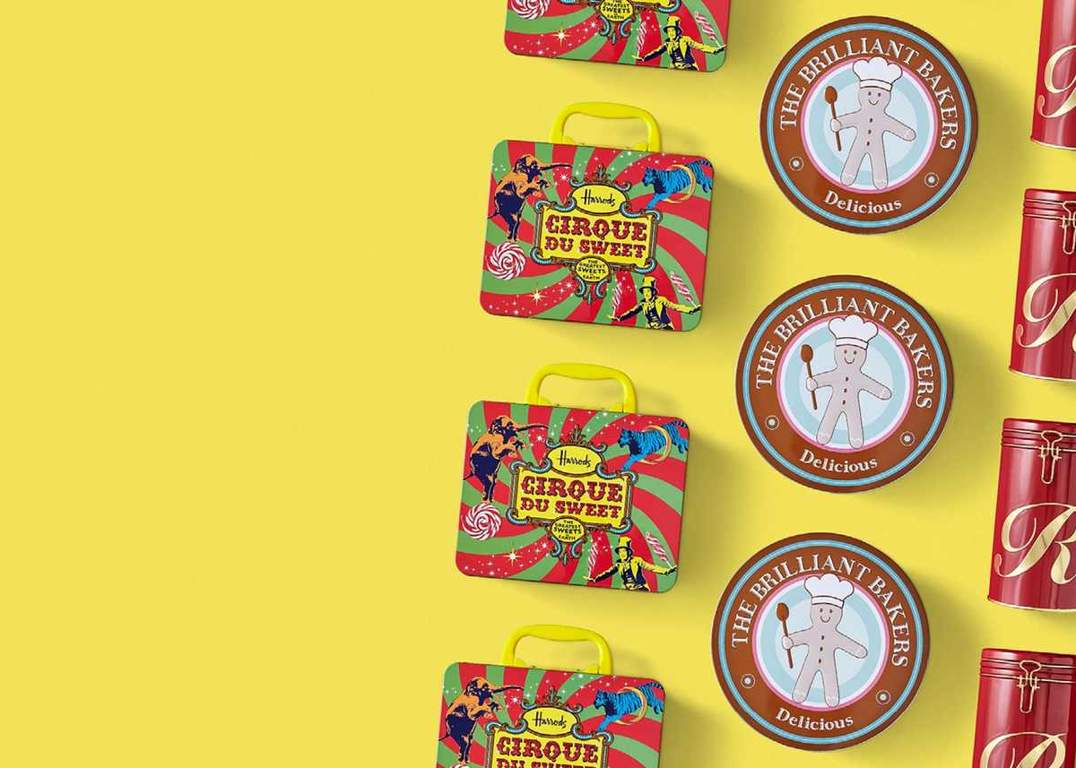 Three different types and shapes of tins laid out in a line against a yellow background. The metal packaging contains biscuits, cakes, sweets or coffee.