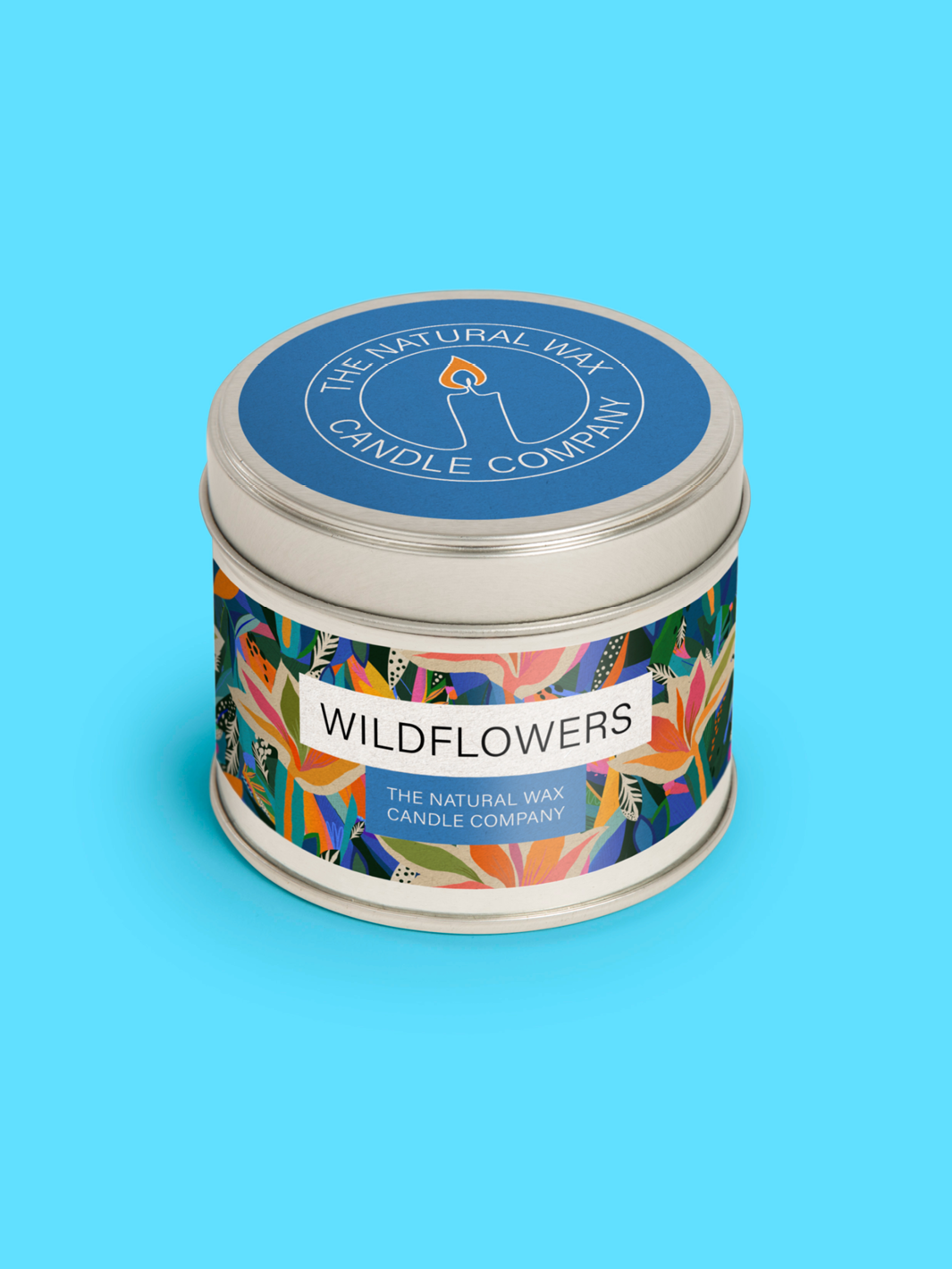 A picture of a candle tin with a wildflower fragrance label.