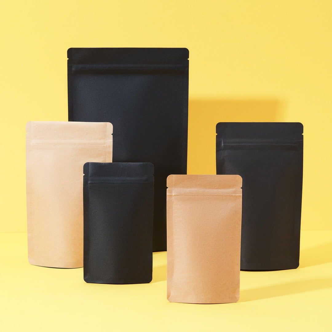 Stand Up Pouches In Black And Brown in two different sizes on a yellow background. 