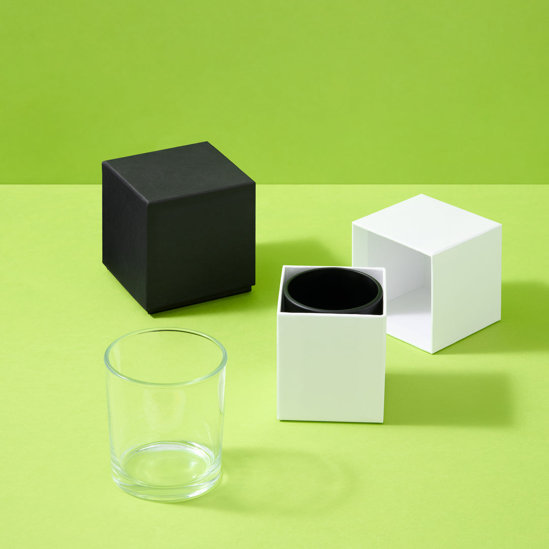 Collection of candle boxes with glass jars