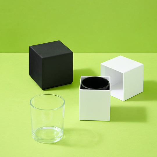 Collection of candle boxes with glass jars