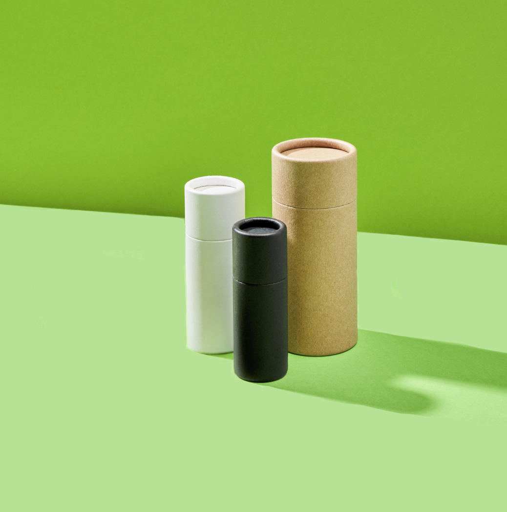 Collection of cardboard push-up tubes in three different colours