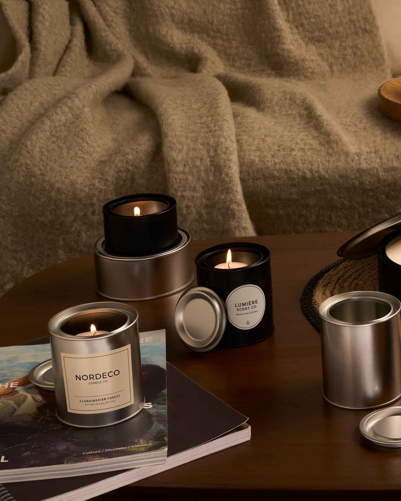Lever lid tins containing candles in a living room. 