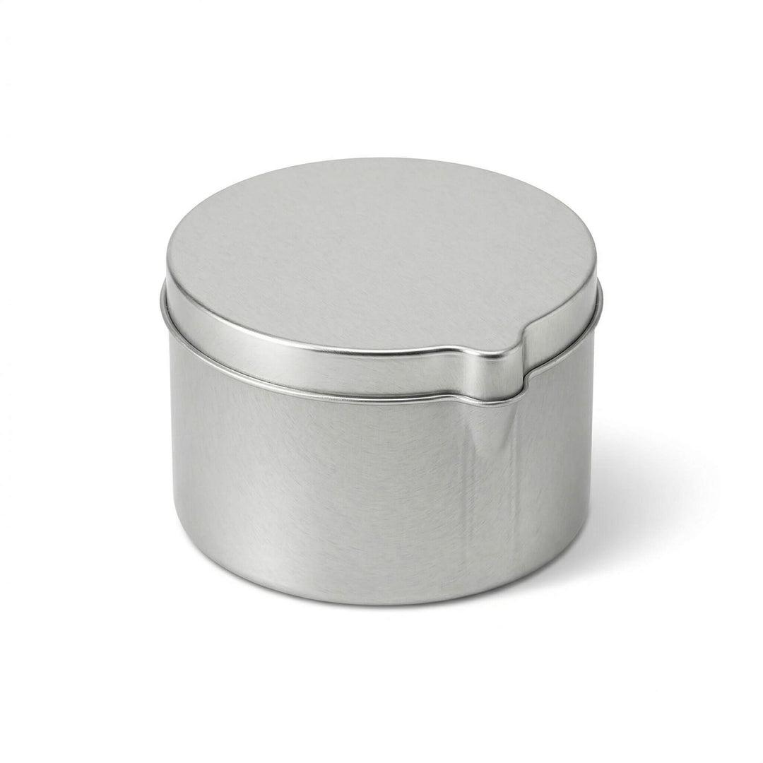A seamless tin with pouring spout in silver.