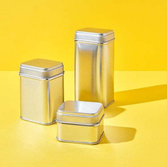 Three silver rectangular stacking tins in different sizes.
