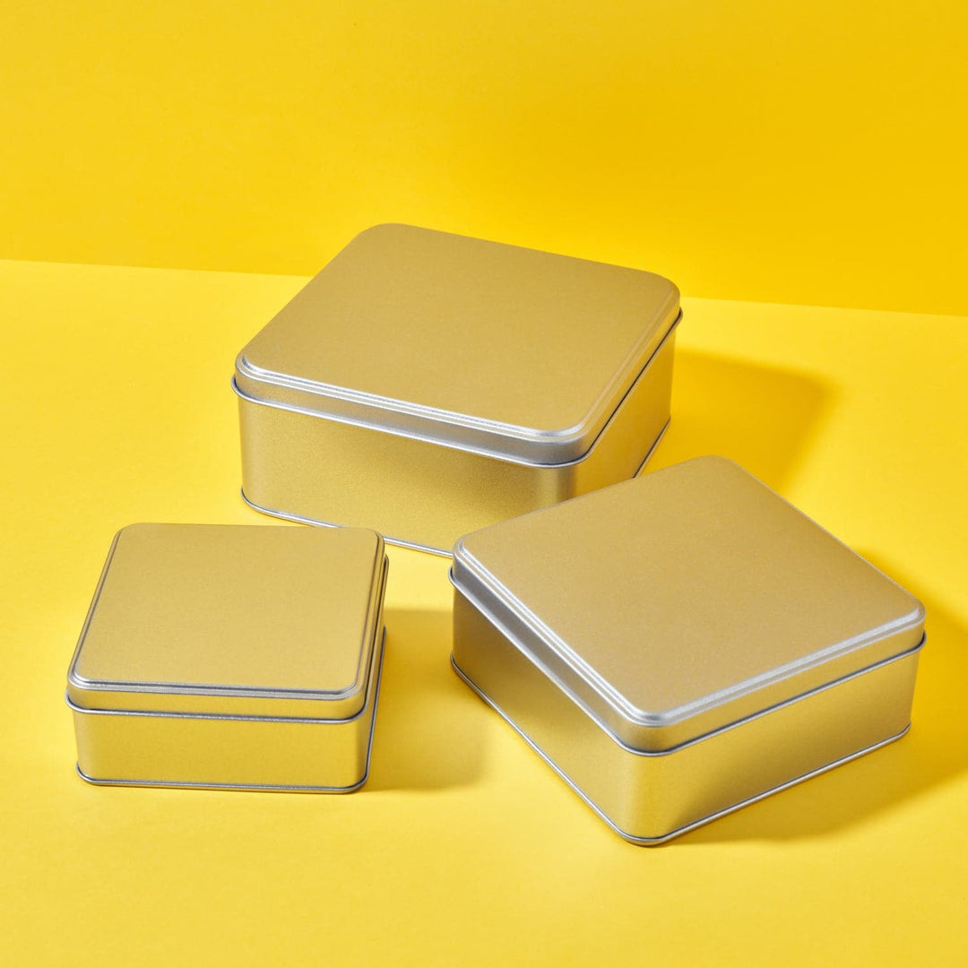Three sizes of square tins with slip lid in silver