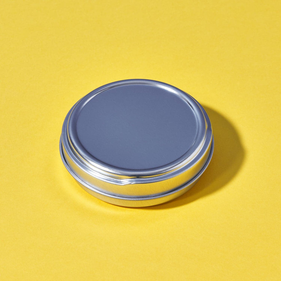 A seamless tin with a push to open lid.