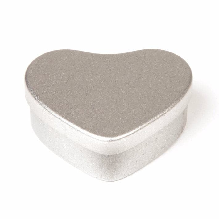 A silver heart shaped tin with product code T5602.