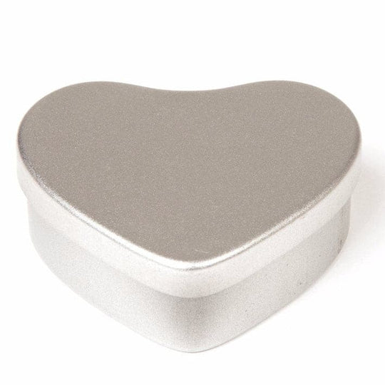 A silver heart shaped tin with product code T5605.