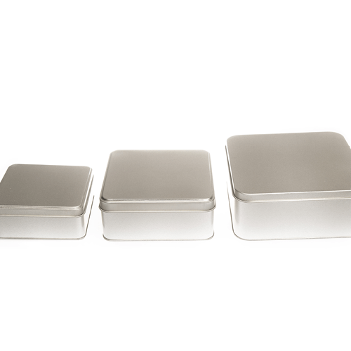 A trio of square silver tins of different sizes.