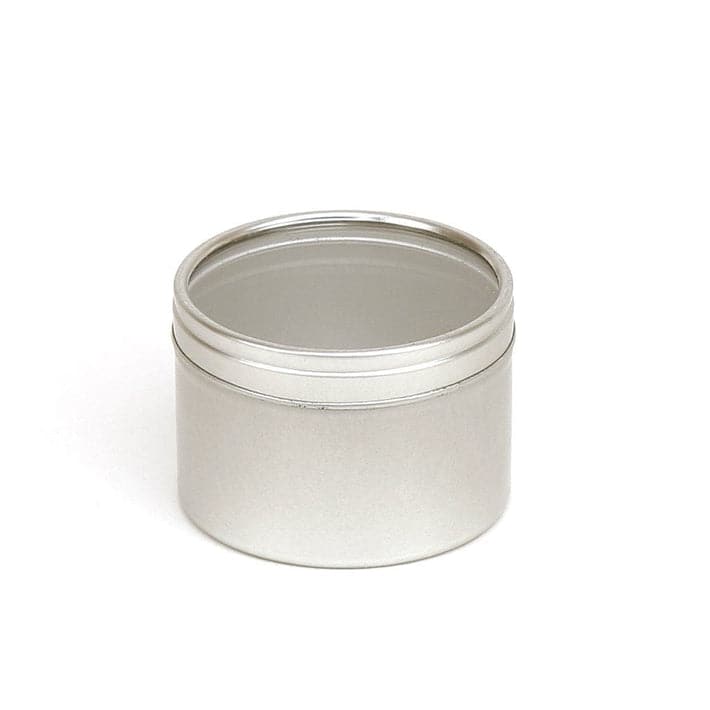 A round silver tin with a clear windowed slip lid with product code T0704W.