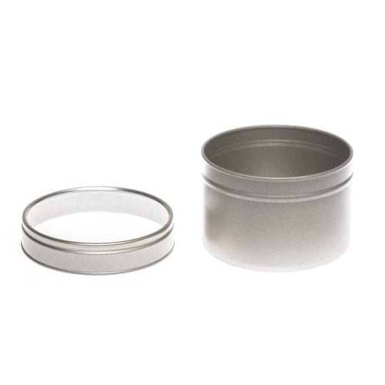 A round silver tin with a clear windowed slip lid with product code T0706W. The lid has been removed and is shown next to the tin.