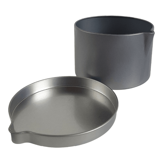 A seamless tin with pouring spout in silver with its lid off.